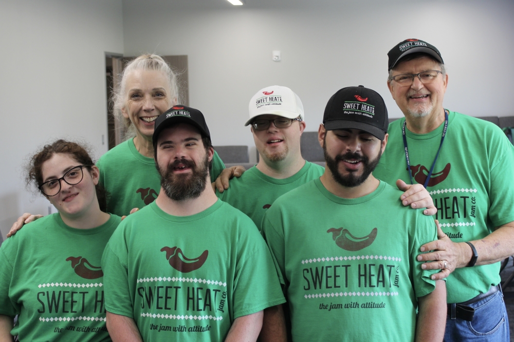 Texas Sweet Heat Jam founders (clockwise from top left) Christine, Nolan and Randy Stilwell pose with employees Eric Hernandez, William Mullican IV and Chrystal Urias. (Daniel Schwalm/Community Impact)
